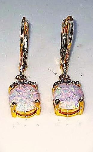Dazzling 4 Cttw Welo Color Play Lab Simulated Opal Earrings: Stunning 4 Cttw Pair of Welo Rainbow Simulated Opal Earrings. These pair of Welo Opals are Fine Polished Cabochon Cut complimented by sparkling CZ accent stones and are Mounted in 14 K Yellow Gold