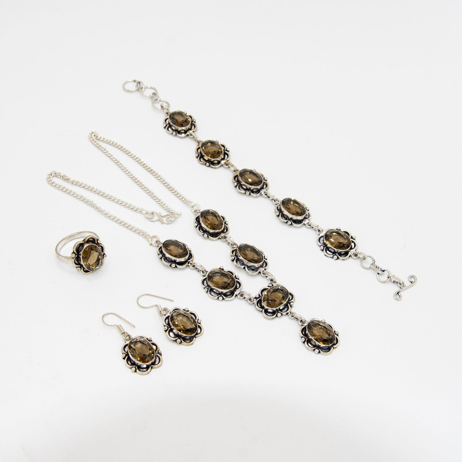 Lovely 4 Piece 287 Ct Topaz Jewelry Set: These lab made imperial topaz are near flawless. They burst out with a dazzling sparkle and vivid even tone. The 4 piece set includes an 18 inch 6 single stone 46.5 ct oval cut faceted necklace, brace