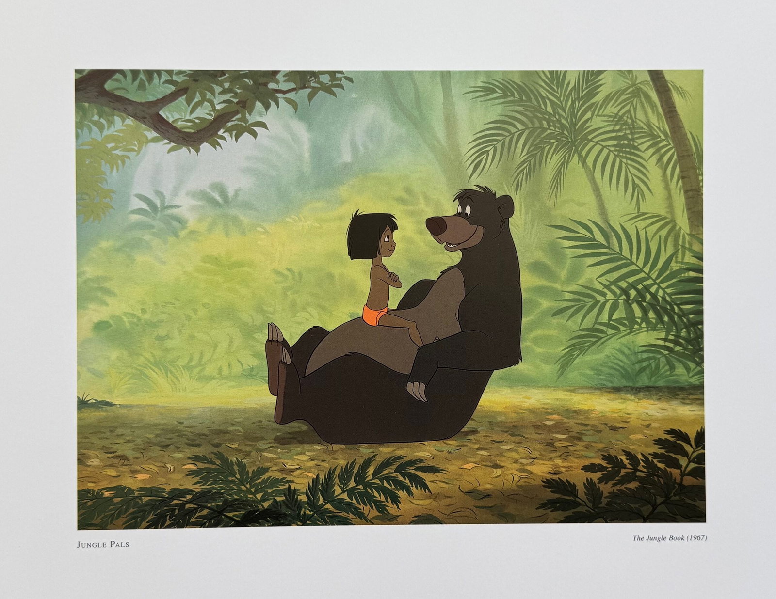 DISNEY THE JUNGLE BOOK MOWGLI & BALOO Lithograph: This is an offset lithograph titled Jungle Pals from Disneys classic film The Jungle Book. Paper measures: 14 inches x 11 inches. Image measures 9 inches x 6.5 inches. Comes unframed. In excellent con