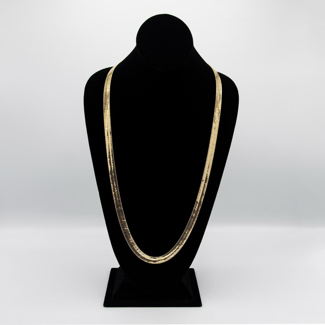 Sharp 42 Gram 14Kt Gold Plate Herringbone Necklace: Sharp 42 Gram 14 Kt Gold Plated Herringbone Necklace. This herringbone necklace is a fine solid Italian cut. It is 30 inches long and a healthy 9.5 mm.