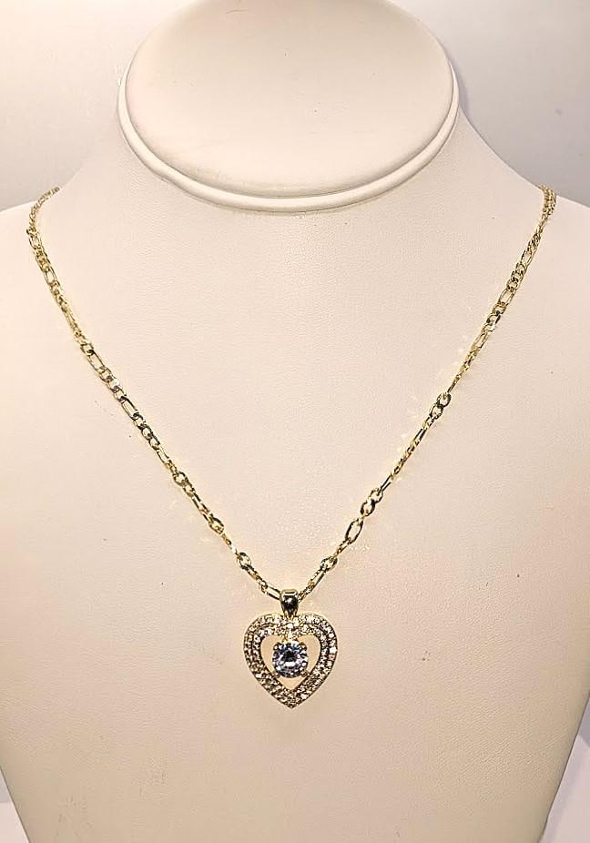 Breathtaking 2 Ct Heart Simulated Diamond Pendant Necklace: Breathtaking 2 Ct Ice White Heart Lab Simulated Diamond Pendant Necklace. The Necklace is an 18" Italian Figaro Cut. All of these gemstones are white eye-clean and are mounted in 14 Kt Yellow Gold Pla