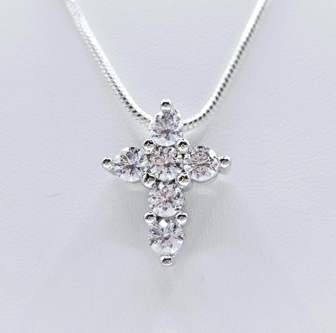 Sparkling 14 Kt White Gold Plated Moissanite Cross Pendant: These VVs1 White E-F Fire Moissanites are eye clean brilliant round cuts measuring 4.5 mm. The color is E-F. They VVs1 are eye clean and bursting out with a full spectrum of colors. They Are Mounted I