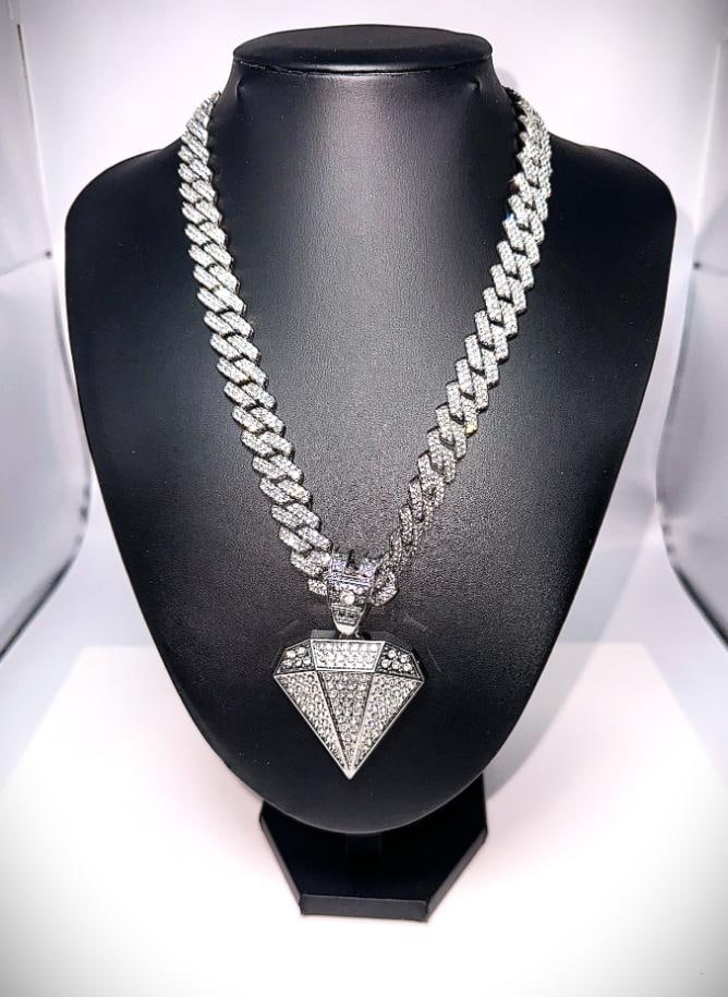 103.5 Gram 18 Kt White Gold Plate Simulated Diamond Pendant Necklace: This Huge 103.5 Gram Lab Simulated Diamond Miami Curb Link Chain Necklace Is a Stealth 14 mm wide and 18" long. 103.5 Gram Wt. A-1 Top Notch.