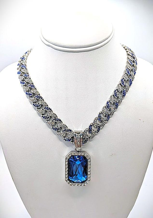 Plate 14Kt White Gold Simulated Tanzanite Pendant Necklace: Beautiful 14 Kt White Gold Plate Blue Violet Lab Simulated Tanzanite Pendant Chain Necklace. This Large 17.5 Ct Lab Simulated Emerald Centersone is a VVS1 Eye-Clean Emerald Cut Measuring 25 x 18 mm. I