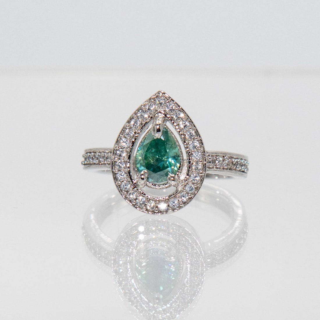Lab Created 2ct Emerald Green Lab Moissanite Ring: Stunning 2 Ct Emerald Green Color Moissanite Ring. This Lab Created Moissanite Center Stone Is Near Flawless. It Will Test Positive For A Diamond On Almost Every Single Diamond Tester. It Is A Fine Pe
