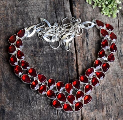 Beautiful 288 Ct Lab Created Red Ruby Necklace: These lab created gemstones are VVS1 eye clean faceted mixed cuts. Mounted in .925 Sterling Silver Overlay.18" long.86.7 Total Grams or 433.5 Cttw. Get Ready For The Compliments On This One.