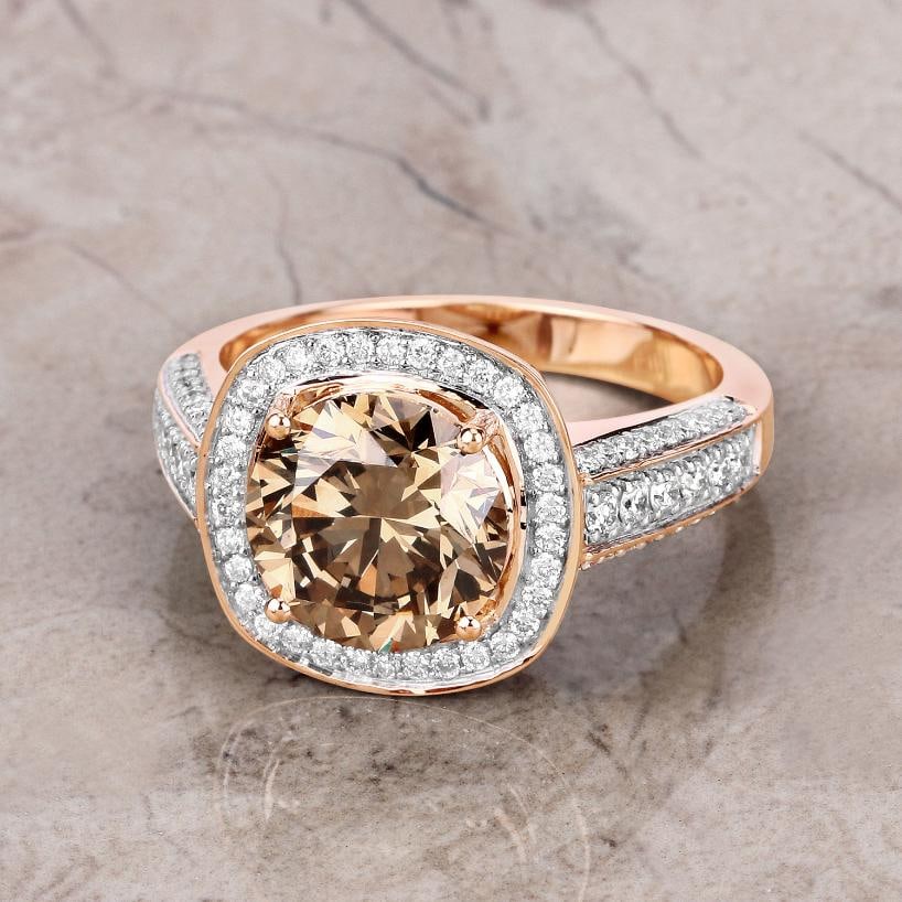 18KT Rose Gold 3.01ct Brown Diamond Ring: Crafted in luxurious 18K rose gold, this fine-finish statement ring is a bold showcase of natural diamond beauty. At its center rests a magnificent 3.01 carat round brown diamond, measuring 8.90mm, se