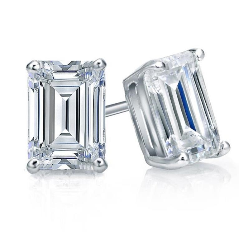 Sparkling 2.05ctw VVs1 White F-G Fire Moissanite Earrings: These 2 Sparkling Fire Moissanites are Vvs1 Emerald and F-G in color 7 x 5 mm Emerald Cuts. These Moissanite are near flawless and bursting out with a full spectrum of colors. They are mounted in .925