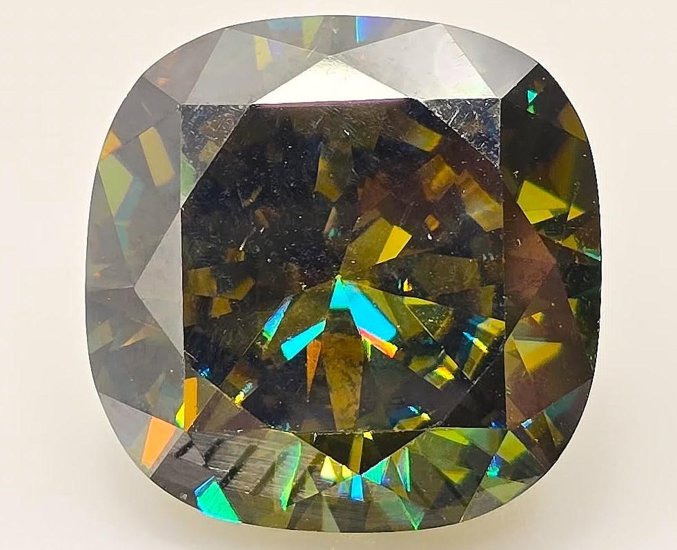 Huge Exceptional 16.5 Ct Sparkling Green Lab Simulated Diamond: This Exceptional 16.5 Ct VVs1 Lab Simulated Diamond Is a Fancy Cushion Cut Measuring 15 x 14.7 mm. It is eye clean and Bursting Out with a Full Spectrum of Colors. ***With a refractive index of 2.65-2