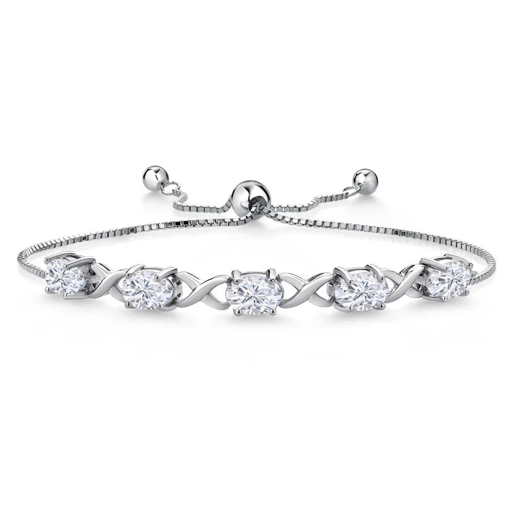 Sterling Silver 4.50ctw Moissanite Bracelet: 5 Moissanite oval stones with a total weight of 4.50cts. Each stone is 0.90cts with a near flawless color measuring 7x5mm. Fully adjustable up to 9 inches.