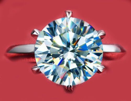 Sparkling 3.5 Ct Ice Blue Fire Moissanite Ring: Sparkling 3.5 Ct VVs1 Ice Blue Fire Moissanite Ring. This Fire Moissanite is a VVs1 eye clean brilliant round cut measuring approx. 9.2 mm. It is mounted in high polished Solid .925 Sterling Silver. R