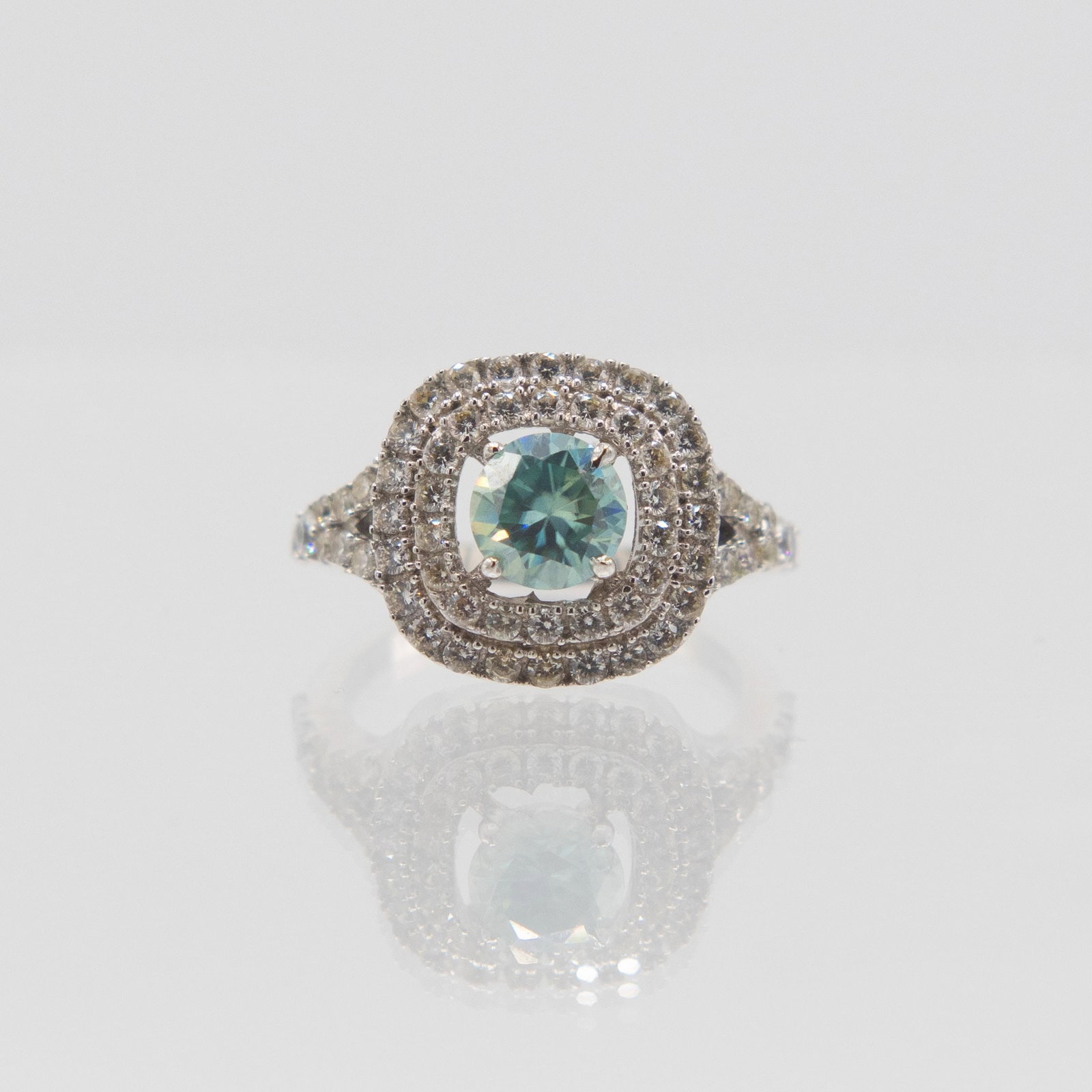 2.5Ct Emerald Green Moissanite Ring: Stunning 2.5 Ct Emerald Green Color Moissanite Ring. This Moissanite center stone is near flawless. It will test positive for a diamond on almost every single diamond tester. It is a fine brilliant ro