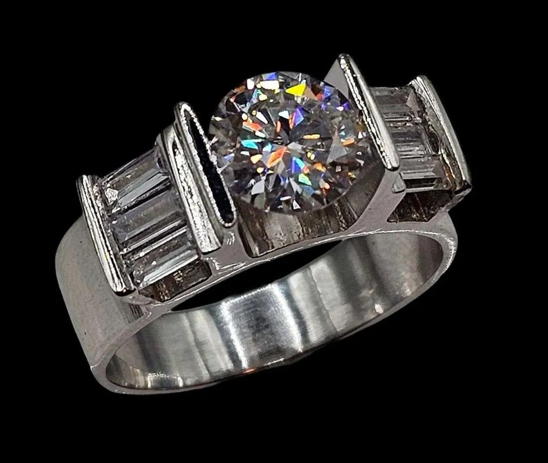 Men's Sparkling 2.75 Ct VVs1 White Fire Moissanite Ring: This 2.75 Ct Fire Moissanite is a VVs1 eye clean approx. E-F in color brilliant round cut measuring approx. 8 mm. It is mounted in high polished Solid .925 Sterling Silver with 6 sparkling baguette cu