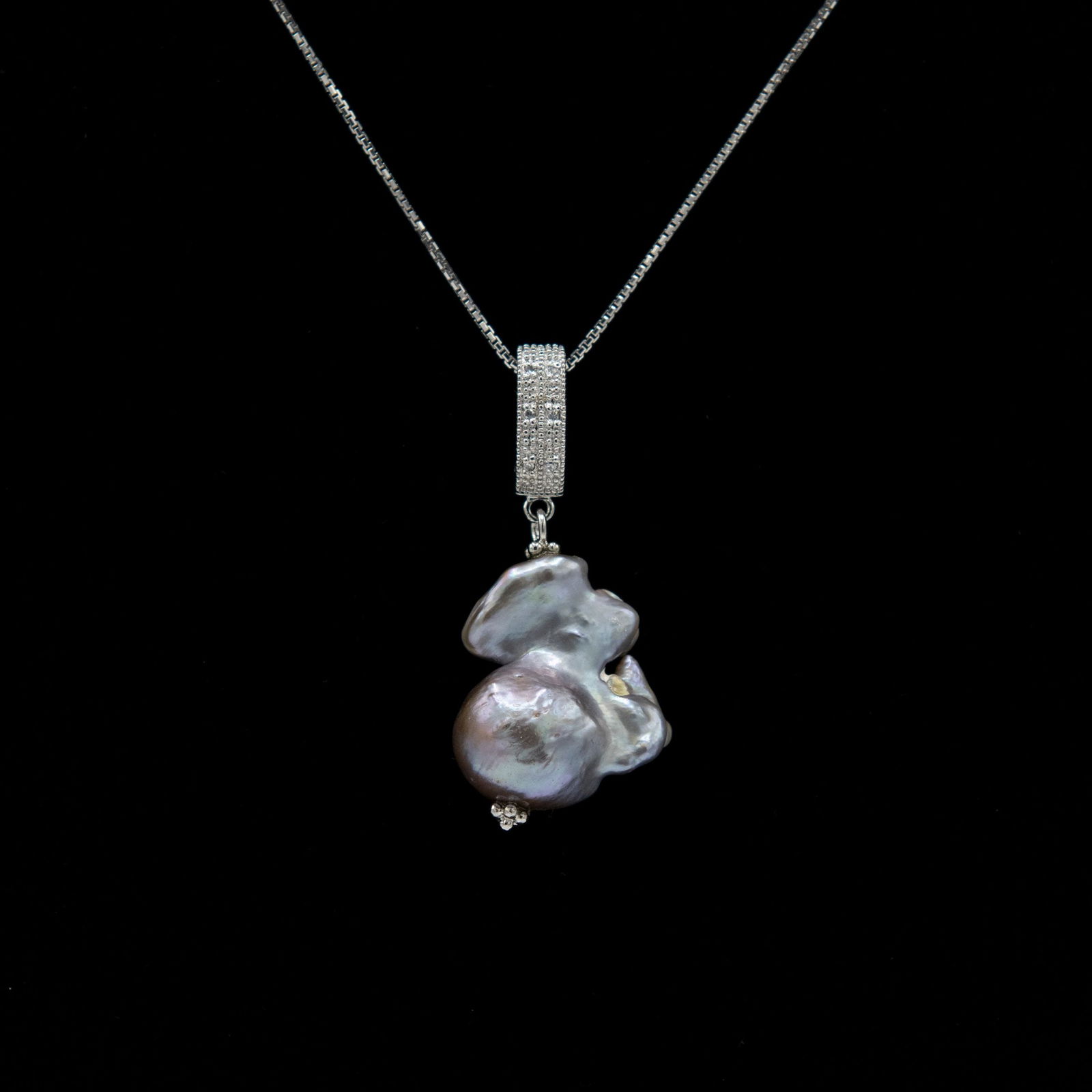 Certified South Pacific Malku Island Pearl Pendant: Natural Certified 7 Grams Maluku Island Pearl Pendant With White Topaz Accents.Origin : Maluku Islands In Indonesia. Treatment : None. This South Sea Beauty Features High Luster & Thick Nacre .Measure