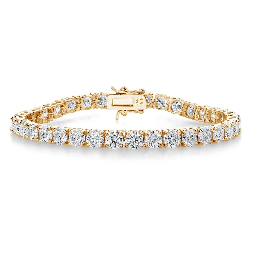 Plated 18KT Yellow Gold 18.00ctw Moissanite Bracelet: Crafted in solid sterling silver with a rich 18K yellow gold plating, this 7 inch link bracelet showcases a continuous line of brilliance with its 185 x 5 mm profile and secure toggle clasp. Each of t