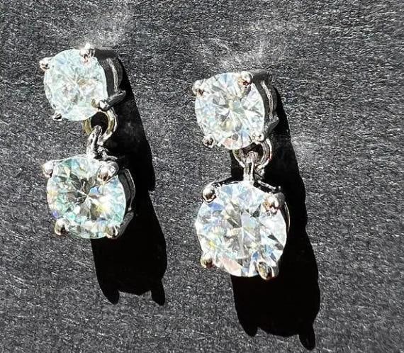 Sparkling 3.25cttw White E-F Fire Moissanite Drop Earrings: These 4 Investment Grade Moissanites Are VVs1 Eye Clean and approx. E-F in color. They are bursting out with a full spectrum of colors. These 4 Brilliant Round Cut Moissanites are mounted in 14 Kt