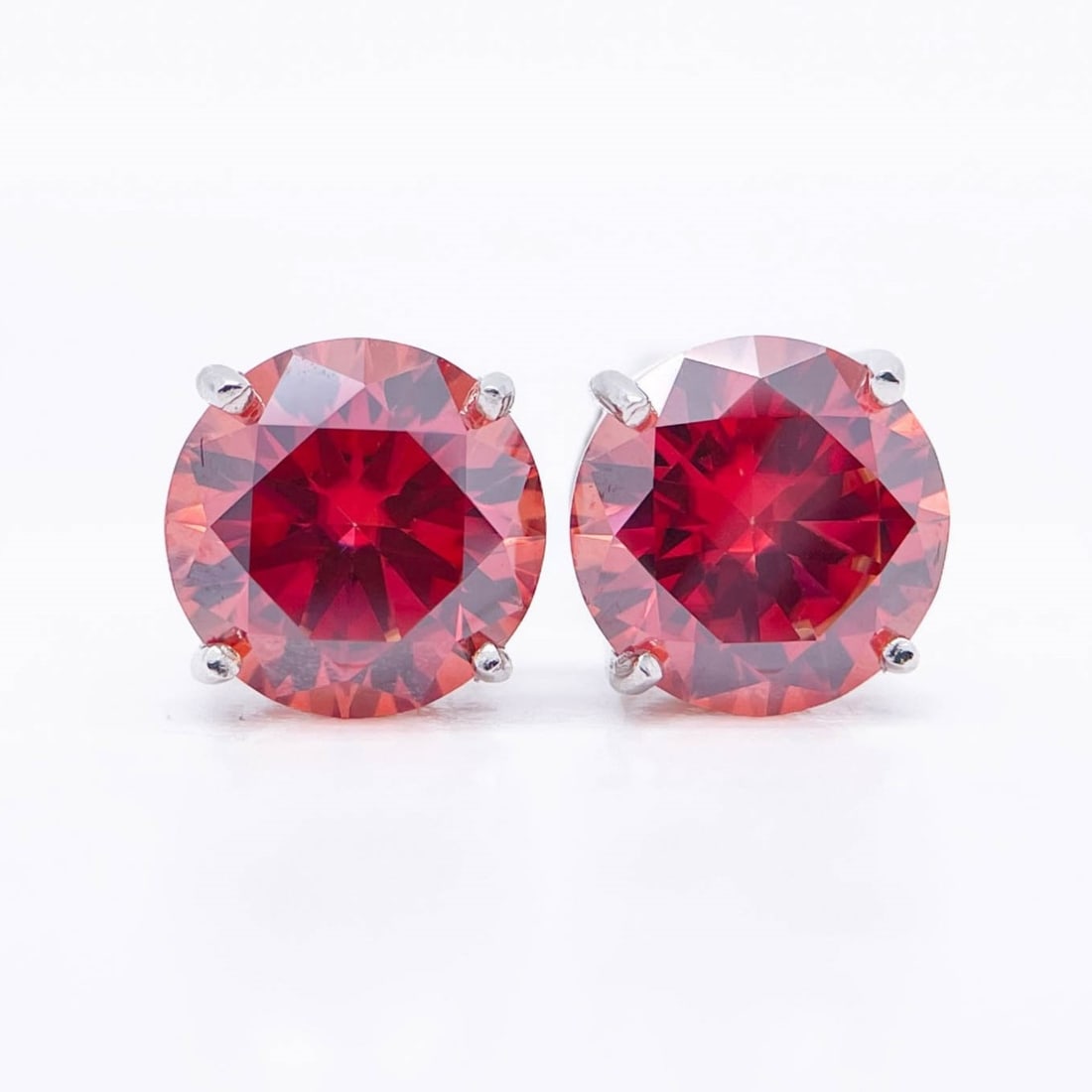 Plated 14KT White Gold 4ctw Lab Simulated Padpaparacha Sapphire Earrings: Dazzling 4 CtW VVs1 Lab Simulated Padpaparacha Sapphire Earrings. These Beautiful Large 4 Cttw simulated Padparacha Sapphire Earrings are eye-clean and bursting out with a electric flashes of color. T