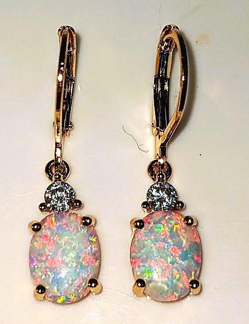 Dazzling 4 Cwt. Welo Color Play Lab Simulated Opal Earrings: Stunning 4 Cwt. Pair of Welo Rainbow Simulated Opal Earrings. These pair of Welo Opals are Fine Polished Cabochon Cut complimented by sparkling cz accent stones and are Mounted in 14 K Yellow Gold Pla