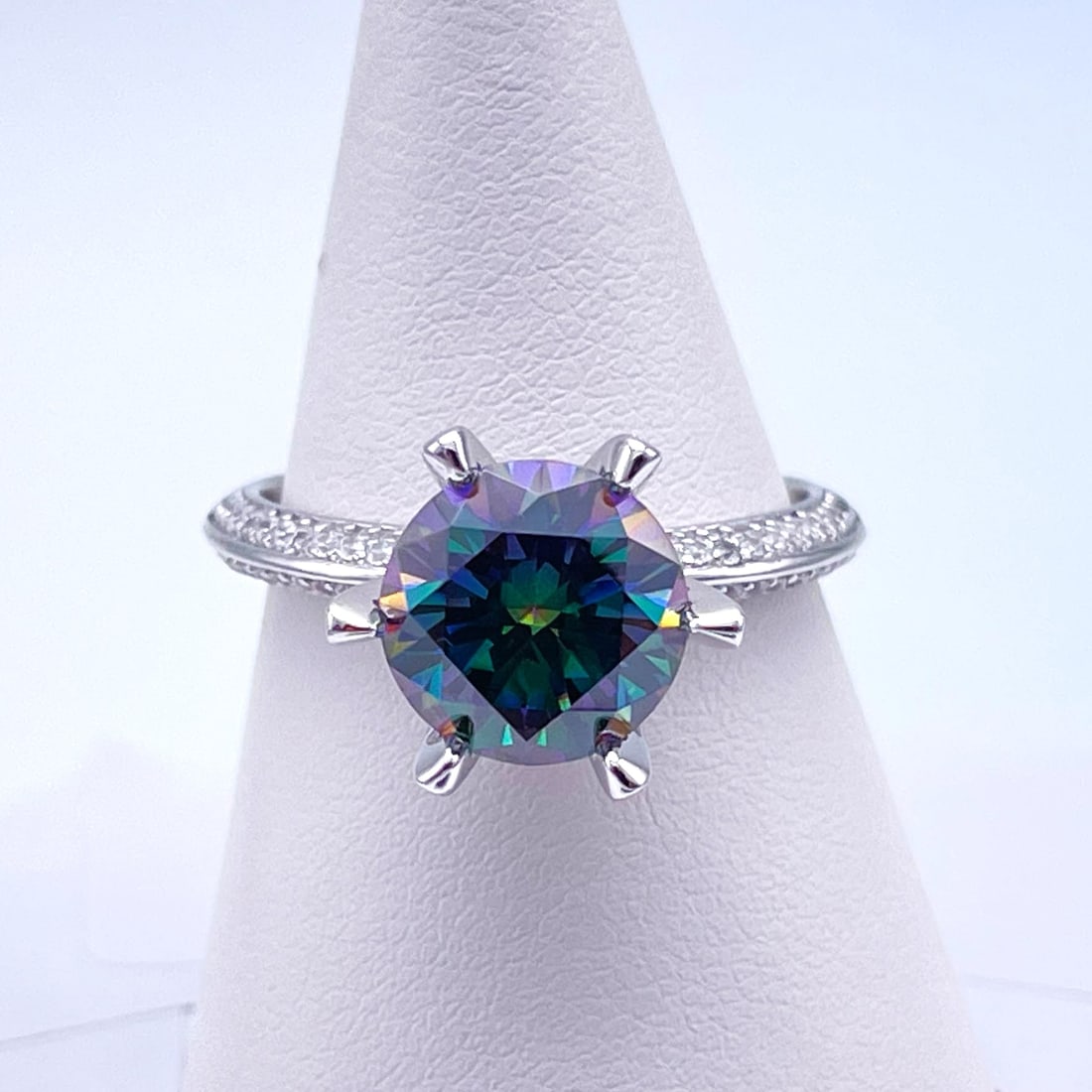 Plated 14KT Gold 3 Ct VVs1 Russian Simulated Alexandrite Ring: This Alexandrite 3 Ct Lab Created Color Change Stone is a VVs1 Eye-Clean Fine Round Cut Measuring 9mm. The color spectrum ranges from beautiful greens, blues and pinks depending on the light and the a