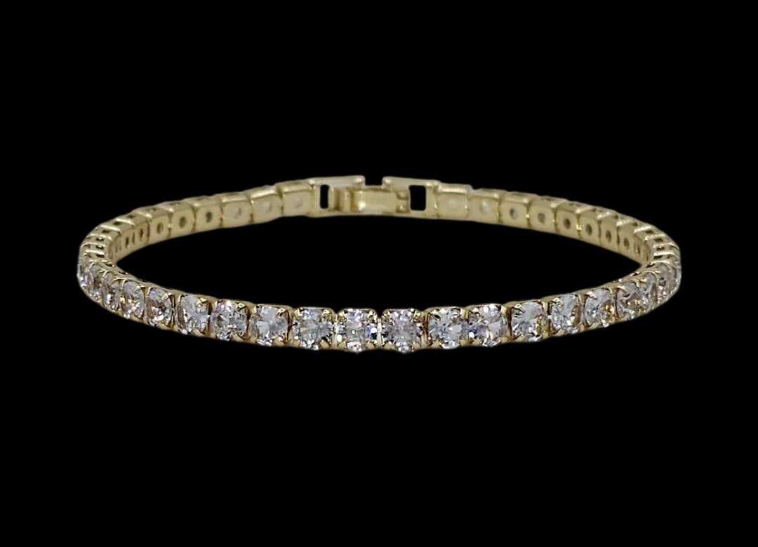 14KT Yellow Gold Plated Lab Simulated Diamond Tennis Bracelet: Sparkling 5.75 Ctw Lab Diamond Tennis Bracelet. These Sparkling Gemstones measure approximately 4mm and are eye clean. They are gold plated, mounted in 14 Kt Yellow Gold Plating. The Yellow Gold Plate