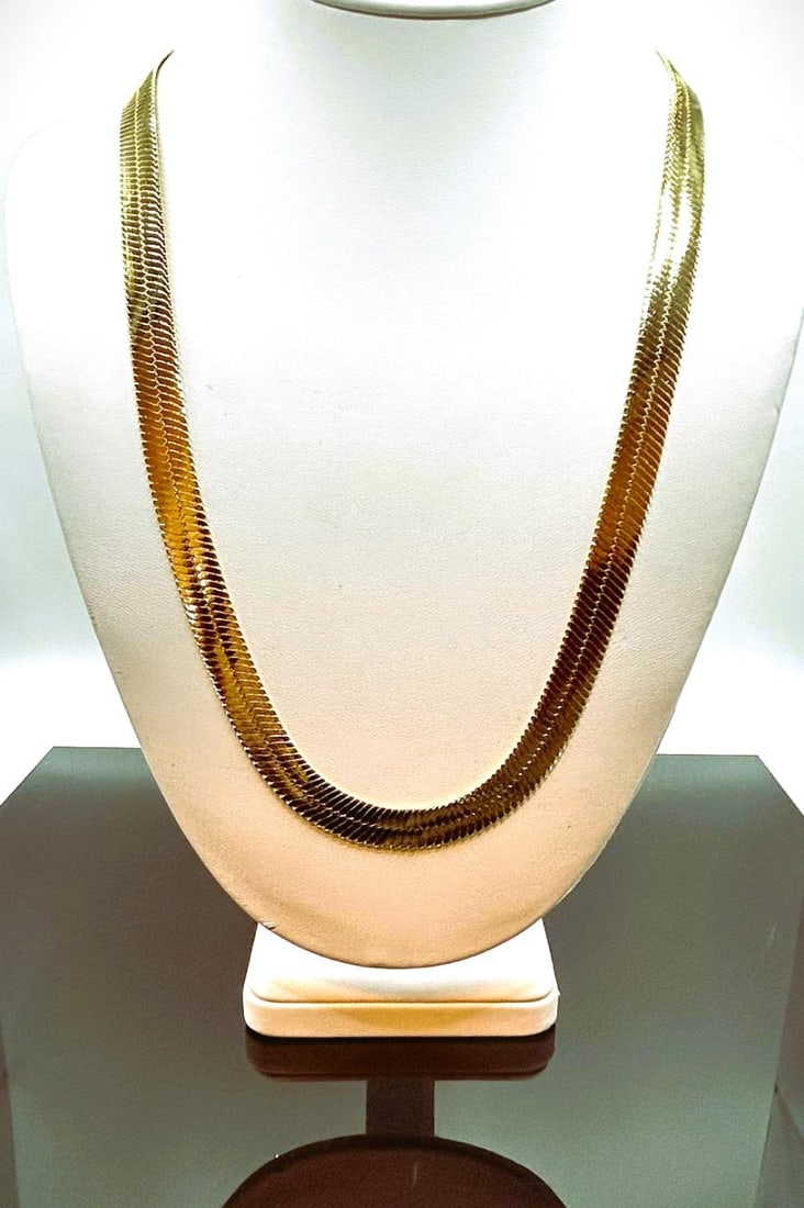 Huge 84.4 Gram 14 Kt Gold Plated Herringbone Necklace: Huge 84.4 Gram 14 Kt Gold Plated Herringbone Necklace. This 14 Kt Gold Plated stamped herringbone necklace is a fine solid 24 inches long and a healthy 14 mm. wide. Total Grams 84.4 This high quality