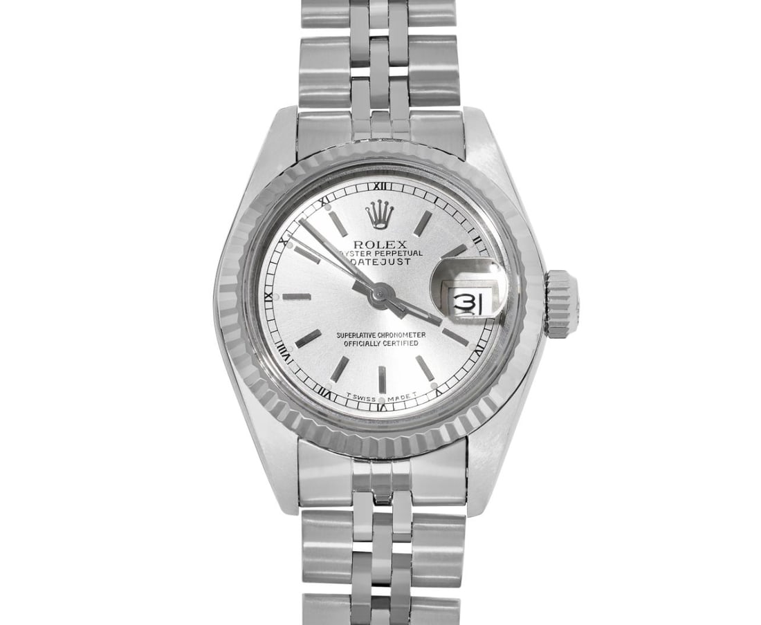 Rolex Ladies Stainless Steel Silver Index Quickset Datejust Watch Fluted Bezel: This Lady Rolex Quickset Datejust watch features a silver dial with index hour markers and a custom sapphire crystal, with a magnified date window. The timepiece has a Rolex 14k white gold fluted