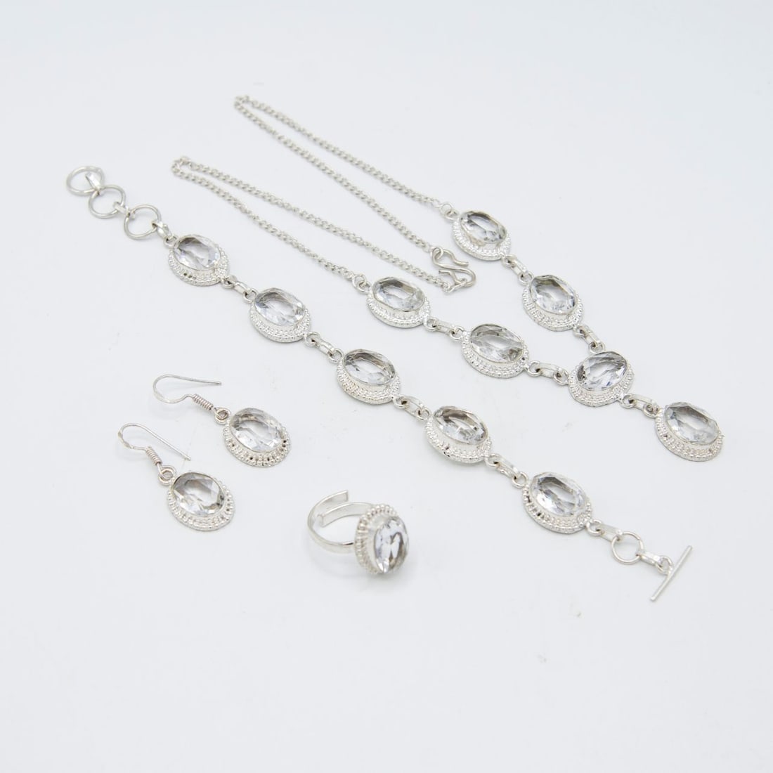 Sparkling Clear Quartz 4 Piece Jewelry Set: Sparkling Clear Quartz 4 Piece Jewelry Set. These faceted clear quartz are near flawless. They burst out with a dazzling sparkle and vivid even tone. The 4 piece set includes an 18 inch 6 single
