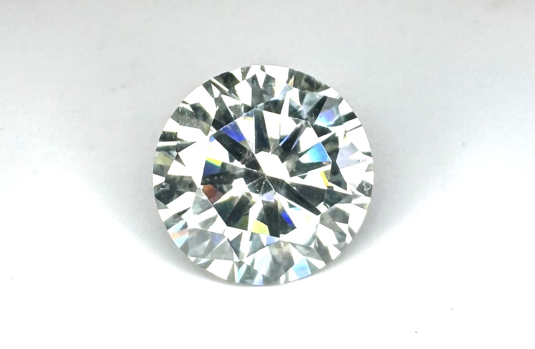 Sparkling 8.26 Ct VVs1 F-G White Fire Moissanite: Sparkling Huge 8.26 Ct Brilliant Round Cut Fire Moissanite. This Fire Moissanite measures 13.4 mm. Color is White E-F. This Fire Moissanite is VVs1 eye clean and bursting out with a full spectrum of