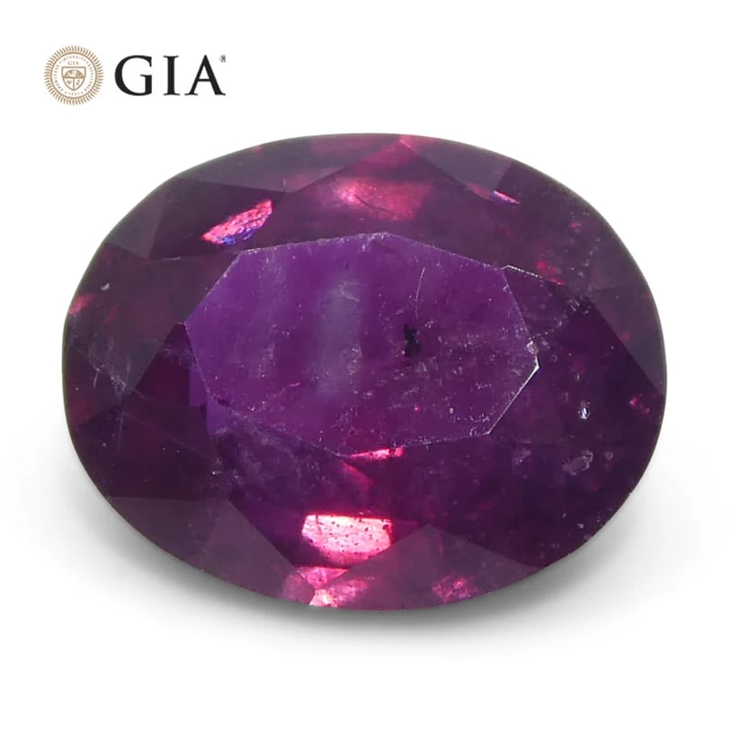 Breathtaking 1.83 Ct GIA Certified Natural Ruby: Elegant 1.83 Ct Purple-Red Ruby is an oval brilliant cut measuring 8.27 x 6.75 x 3.76 mm. This investment-grade Ruby displays a medium dark tone and strong saturation. Absolutely gorgeous!!! Origin: P