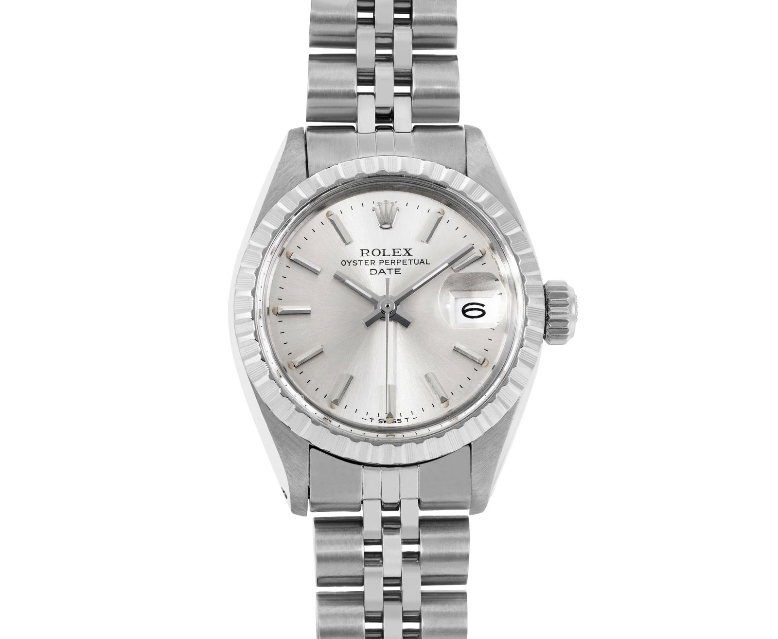 Rolex Ladies Stainless Steel 26MM Engine Turn Date Watch: This Lady Rolex Date watch features a silver dial with index hour markers and a custom plastic crystal, with a magnified date window. The timepiece has Rolex stainless steel engine turn bezel. The Rol