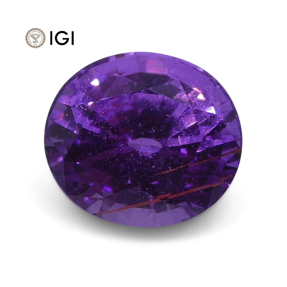 Pretty IGI Certified 1.23 Ct Natural Sapphire: Vivid 1.23 Ct Pinkish Purple Sapphire measuring 6.24 x 5.54 x 4.26 mm with a mixed oval cut. The color and tone on this sapphire is absolutely stunning! Treatment: None. Please see the certification f