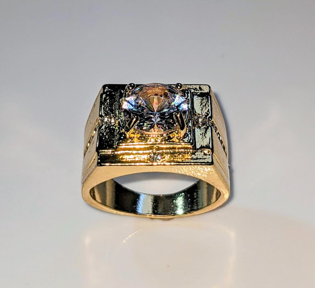 Men's 14 K Gold Plate 3.5 Ct VVs1 Lab Simulated Diamond Ring: Men's Dynamic 14 Kt Yellow Gold Plated 3.5 Ct VVs1 Lab Simulated Diamond Ring. The center-stone is a 8.5 mm. Brilliant Round Cut, It is bursting out with a full spectrum of colors. This Ring is compli