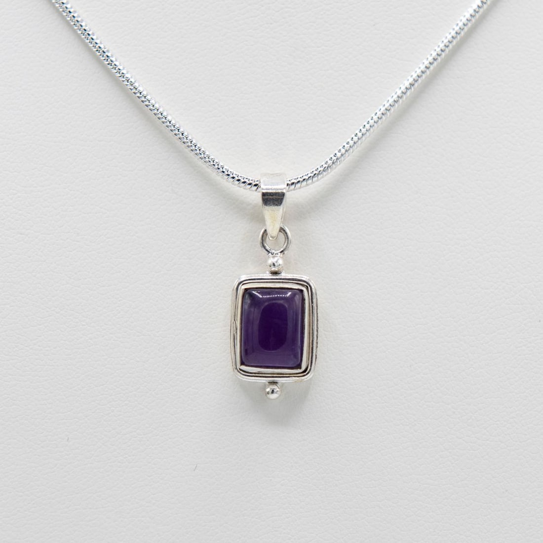 Beautiful Natural 2.5 Ct Amethyst Pendant: Rare Emerald Cabochon Cut Bolivian Amethyst Displaying A Vivid Even Royal Purple Hue. Mounted In Solid .925 Stamped Sterling Silver. Includes 20 "Chain.12.4 Total Gram Wt. Or 62 Ctttw.