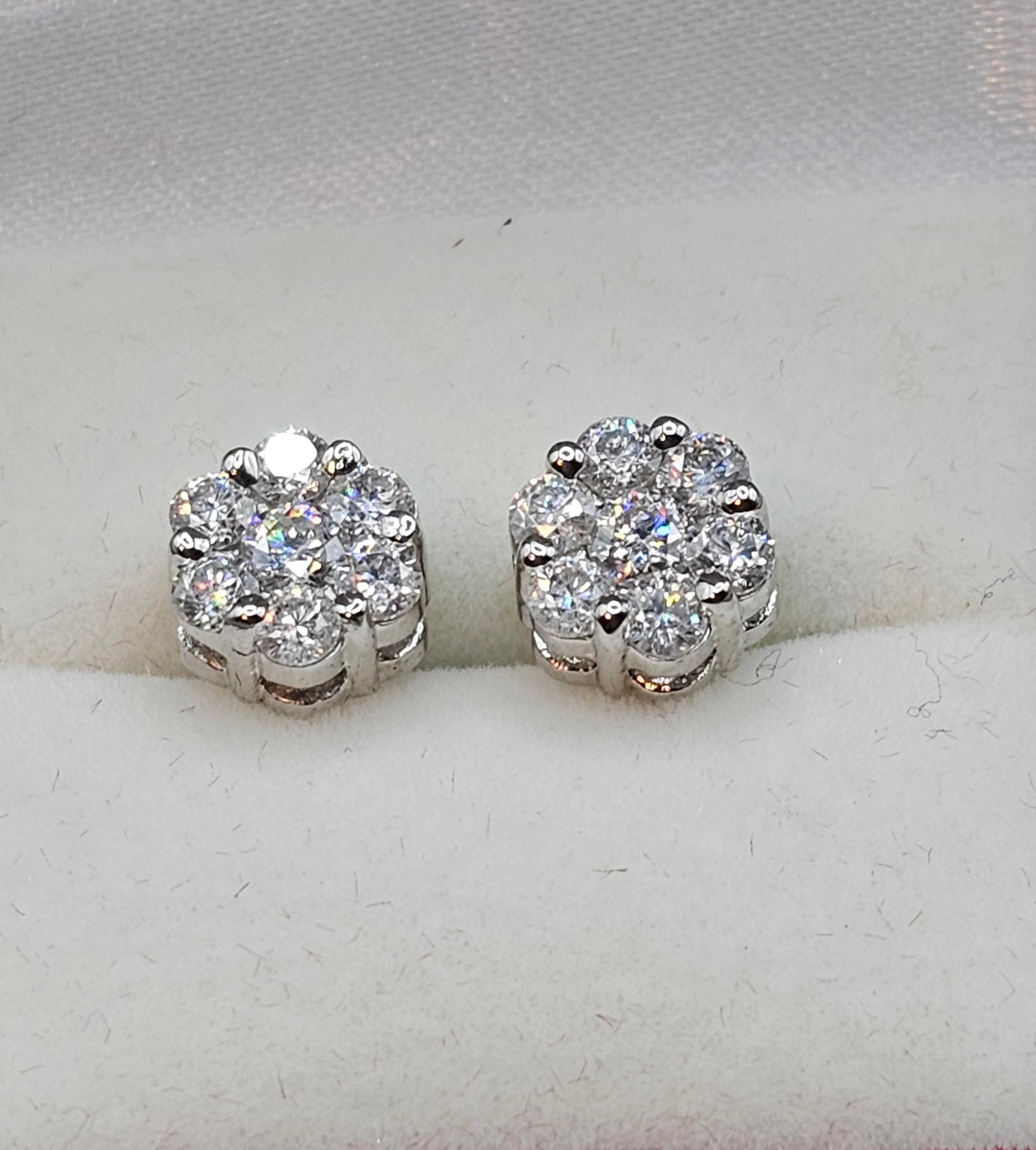 Dazzling 2.5ct VVs1 White E-F Fire Moissanite Cluster Earrings: 14 Kt White Gold Plated 2.5 Ctw VVs1 White E-F Fire Moissanite Cluster Earrings. These 14 brilliant round moissanites are mounted in 14 Kt Tri-Layered White Gold over Solid Sterling Silver. Remarkable