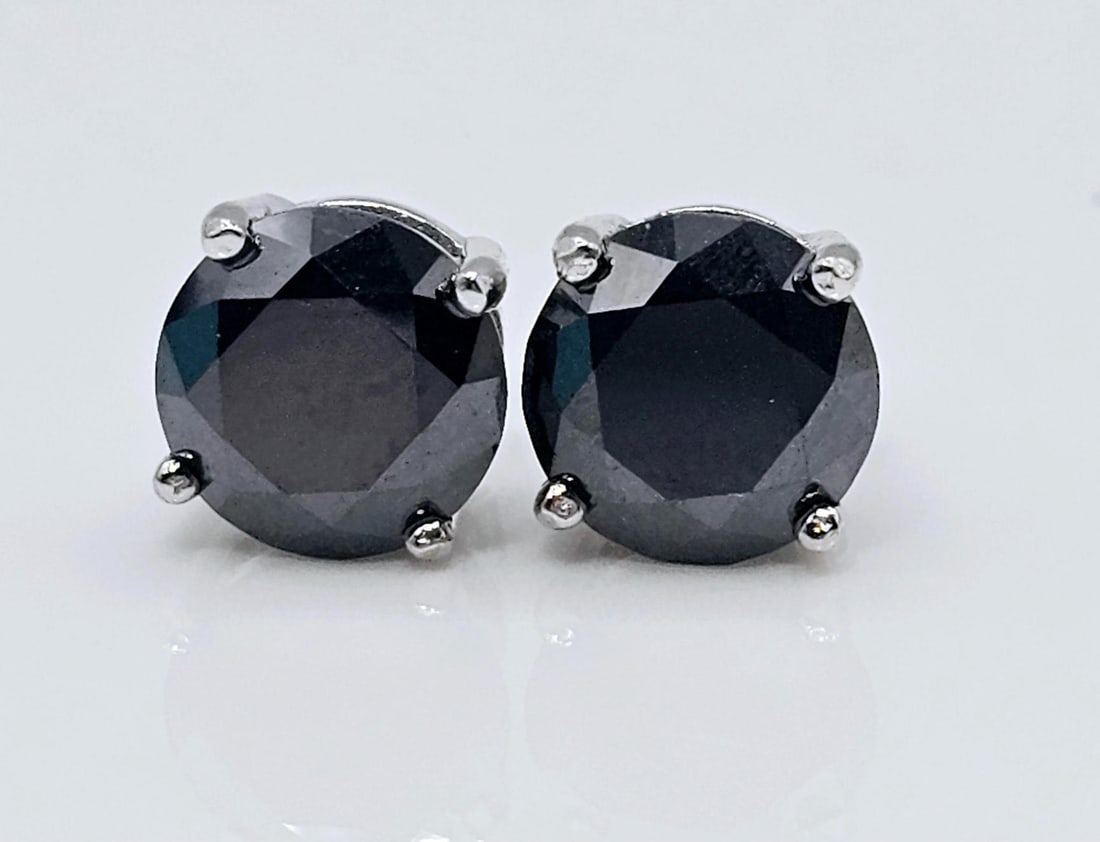 Gorgeous 4 Ctw Black Lab Simulated Diamond Earrings: These 4 Cttw Lab Simulated Diamonds are Silky Black In Color along with a mirror like finish. They are both 8mm. Brilliant Round Cuts. Mounted in 14 Kt Tri-Layered White Gold over Solid .925 Sterling 