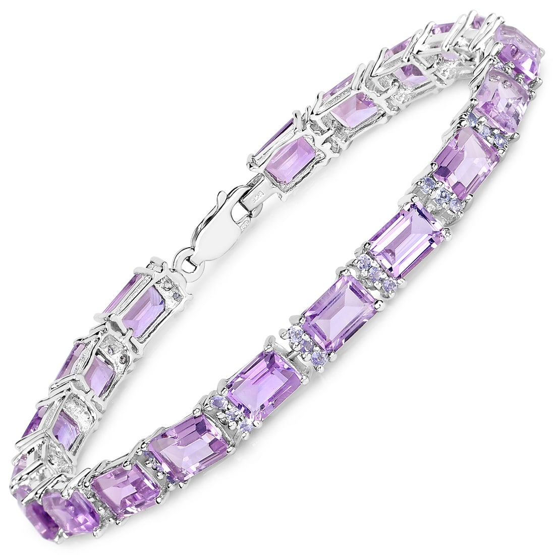 Plated Rhodium 19.19ctw Amethyst and Tanzanite Bracelet: This rhodium?plated .925 sterling silver tennis bracelet showcases a striking combination of natural gemstones, featuring nineteen octagon?cut 7×5?mm amethysts totaling 18.05 carats paired with fifty