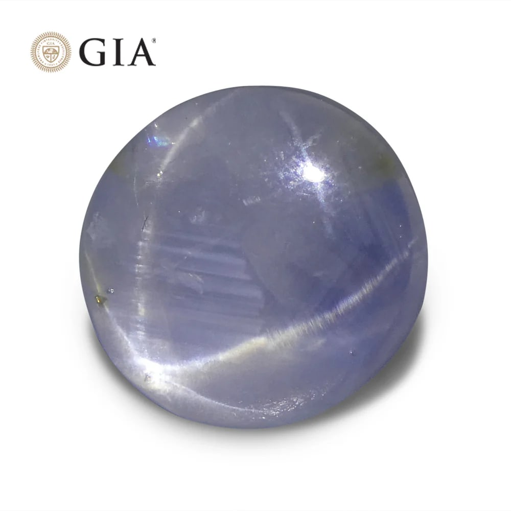Huge Rare 11.99 Ct GIA Certified Natural Sapphire: Majestic 11.99 Ct Blue Star Sapphire is an oval double cabochon cut measuring 11.33 x 10.64 x 9.48 mm. This investment-grade Sapphire reveals a unique, light tone. Absolutely gorgeous! Treatment: None