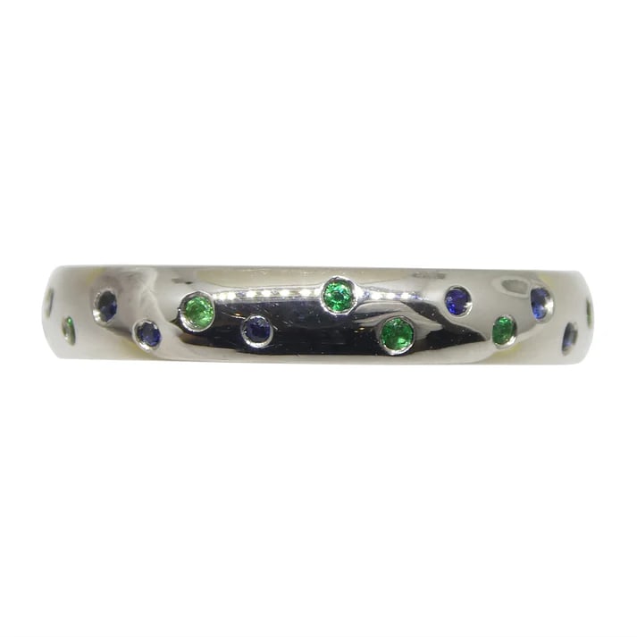 Stunning 0.24 Ct Natural Sapphire & Emerald Ring: Lovely 0.24 Ct Sapphires and Emeralds are round brilliant cuts measuring 1.00 x 1.00 mm. These precious stones are set in 14k White Gold. Do not miss this one! Ring Size: 6. Sapphire Origin: Sri Lanka