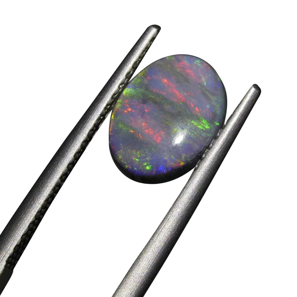 Breathtaking 1.42 Ct GIA Certified Natural Opal: Untreated 1.42 Ct Black Opal is an oval cabochon cut measuring 9.55 x 7.36 x 2.99 mm. Reveals a stunning, natural color with a very dark tone. Do not miss this one! Origin: Australia. Treatment: