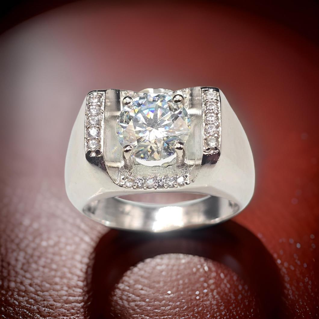 Men's Huge Sparkling 3.45 Ct Fire Moissanite Ring: This 3.45 Ct VVs1 Center Stone Is Dark Amber Green In Color. It is a Brilliant Round Cut Measuring 8.4 mm .Cut It is near flawless and bursting out with a full spectrum of colors. This Moissanite