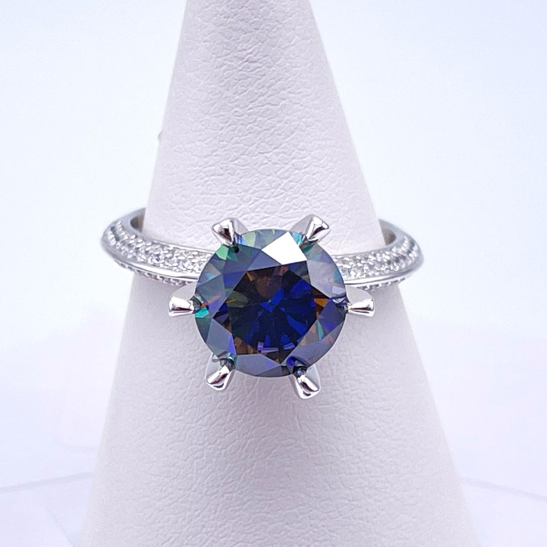Plated 14KT Gold 3 Ct VVS1 Deep Cobalt Blue Fire Moissanite Ring: This Fine 3 Ct Moissanite Centerstone is a VVS1 Brilliant Round Cut Measure sing 9 mm. It has a Deep Purple Cobalt Blue Hue. This fine gemstone Moissanite is near flawless and bursting out with a