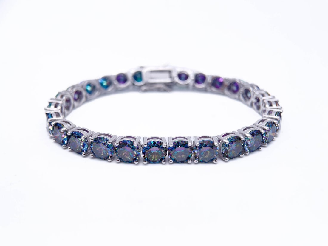 Plated 18KT White Gold 27ctw Russian Color Change Simulated Alexandrite Bracelet: 18 Kt White Gold Plate 27 Ctw VVs1 Russian Color Change Lab Simulated Alexandrite Tennis Bracelet. These 27 Count Russian Lab Simulated Color Change Alexandrite's are both VVS1 Near Flawless Brilliant