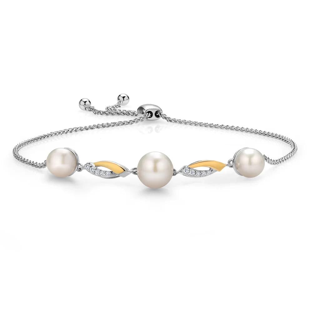 10KT Yellow Gold and Sterling Silver Fresh Water Pearl and Lab Diamond Bracelet: This two?tone bracelet pairs 925 sterling silver with 10K yellow gold, featuring a sleek 9?inch wheat chain that adjusts effortlessly with a slider clasp for a custom fit. Its polished bar measures 23