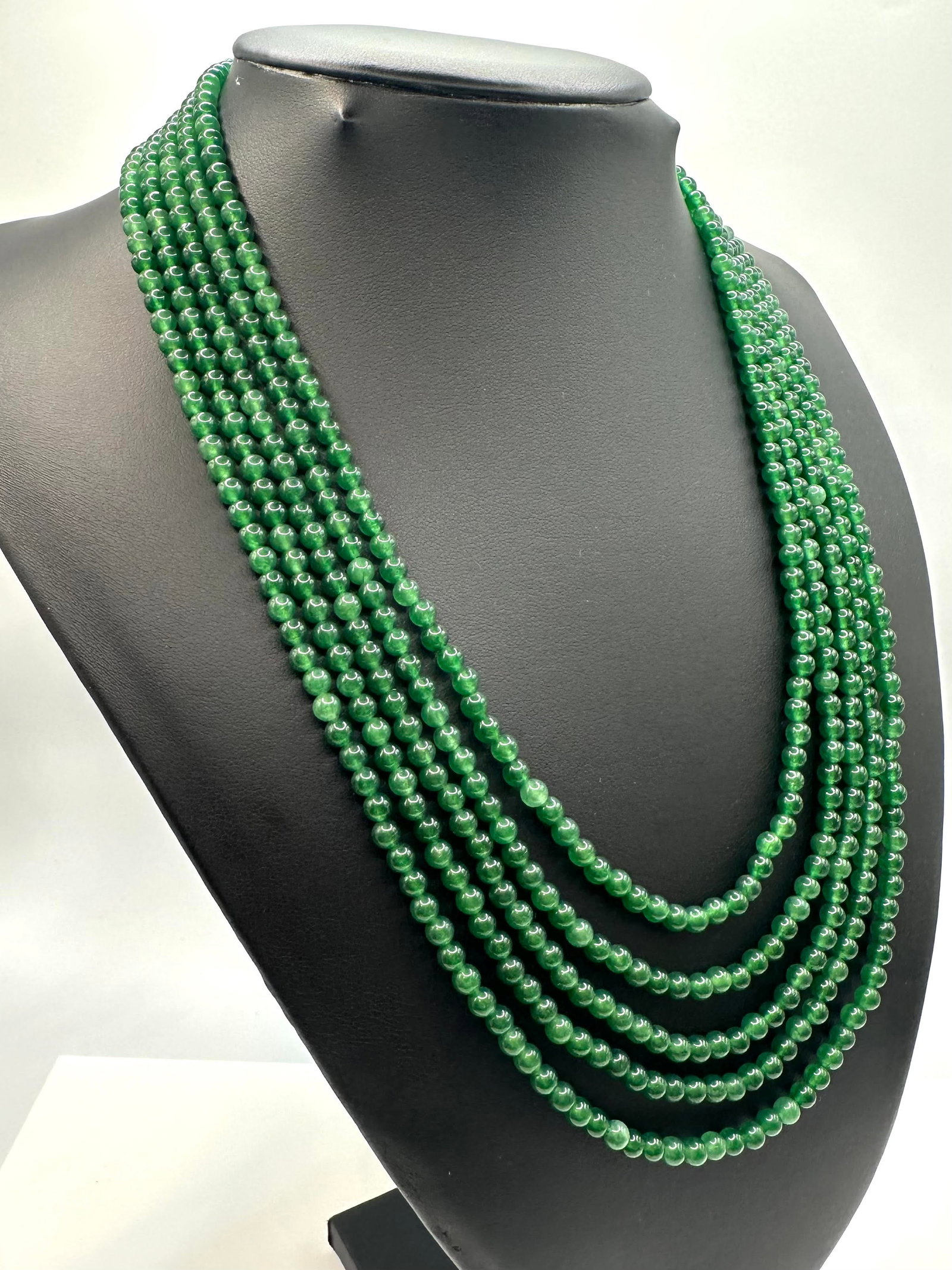 Beautiful Mined From The Earth 324 Ctw Natural Emerald Necklace: Beautiful Natural 324 Cttw. Mined From The Earth 5 Strand Emerald Necklace. These fine polished beads measure approx 4mm. and are near perfect round. The neck size is adjustable from as small as 16 " 