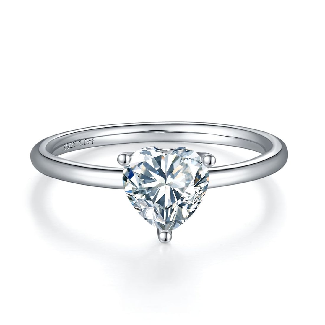 Ladies Sparkling 1 Ct White Fire Moissanite Ring: This timeless designer ring features a 1 Ct Moissanite Centerstone is a VVS1 Brilliant Heart Cut 6.5 mm. The Color is White F-G. It is near flawless and bursting out with a full spectrum of colors. Mo