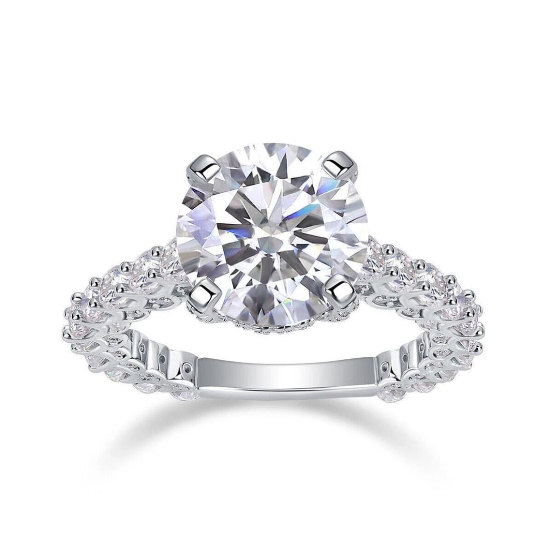 Sterling Silver 5ct Moissanite Ring: Round Moissanite stone with a total weight of 5cts wih a color of D and aclarity of VVS1. This Fire Moissanite is complimented mounted in .925 solid sterling silver with 14 Kt White Gold Overlay, whic