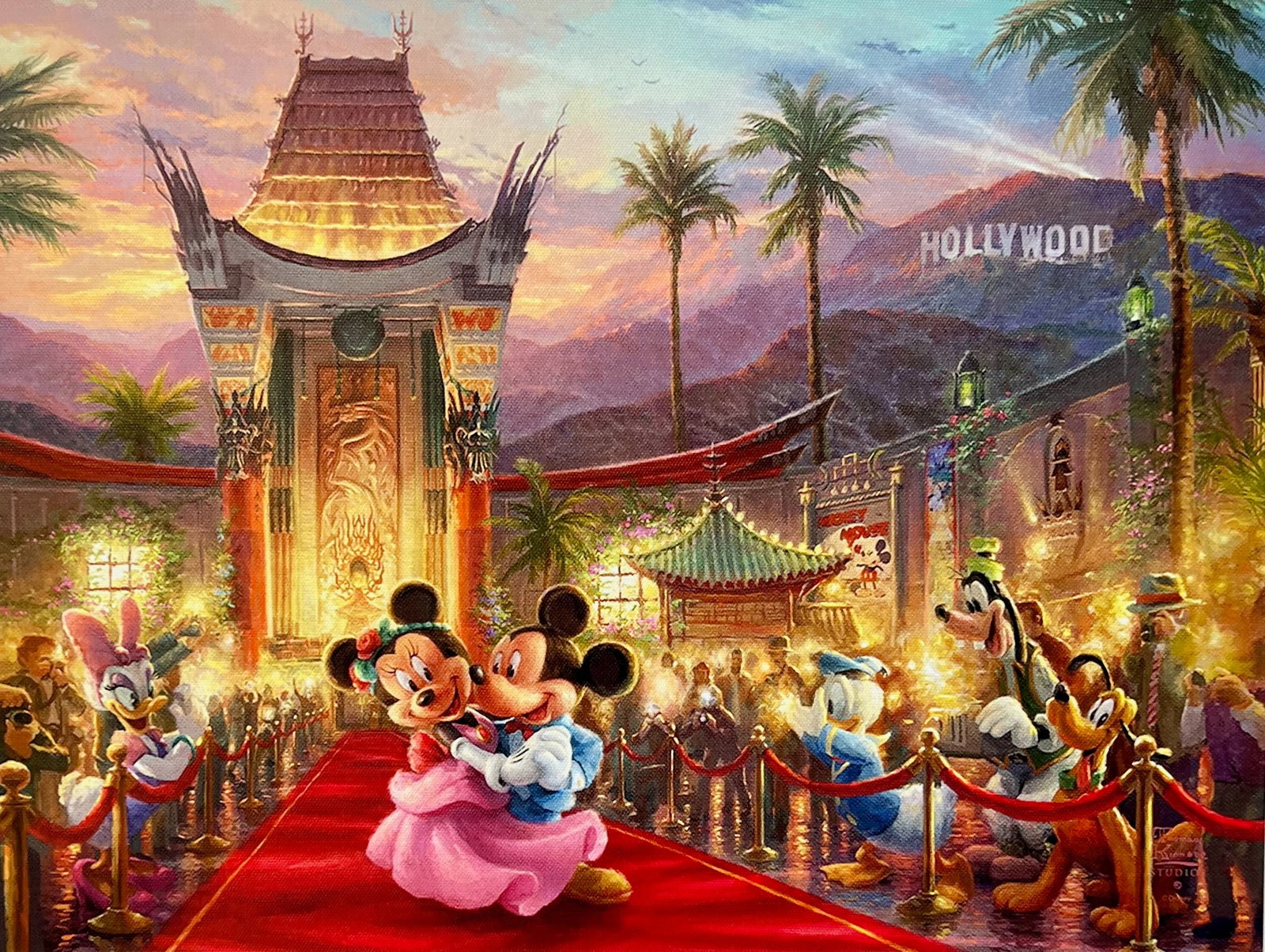 Thomas Kinkade Disney MICKEY MINNIE MOUSE IN HOLLYWOOD Giclee on Canvas: This is a reproduction Disney giclee on canvas by Thomas Kinkade titled Mickey and Minnie in Hollywood. This Giclee also features Pluto, Goofy, Donald and Daisy Duck at a movie premiere at the Hollywo