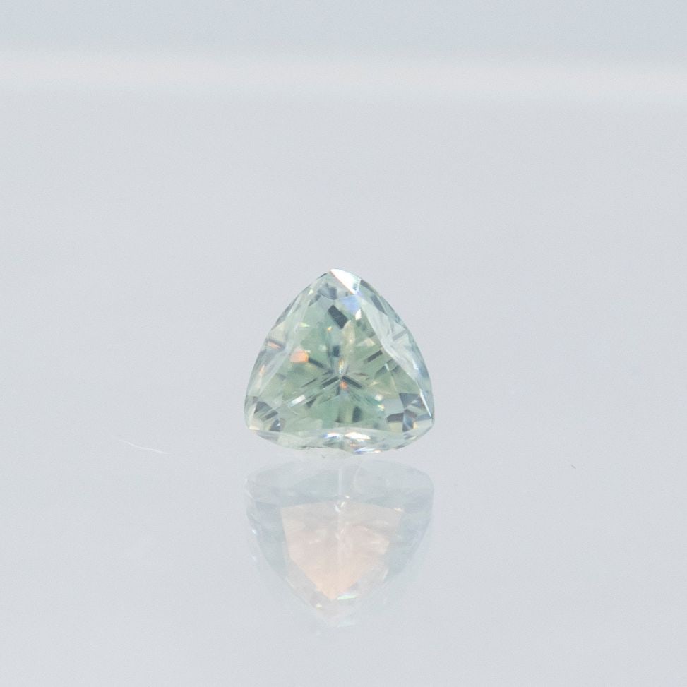 Brilliant 2.22 Ct VVS1 Ice Silver Blue Moissanite: This Ice Blue Moissanite Is a fine trillion cut measuring approx. 8.14 mm. This eye clean moissanite is bursting out with fire and a full spectrum of colors. This Moissanite measures 9.25 on the mohs 