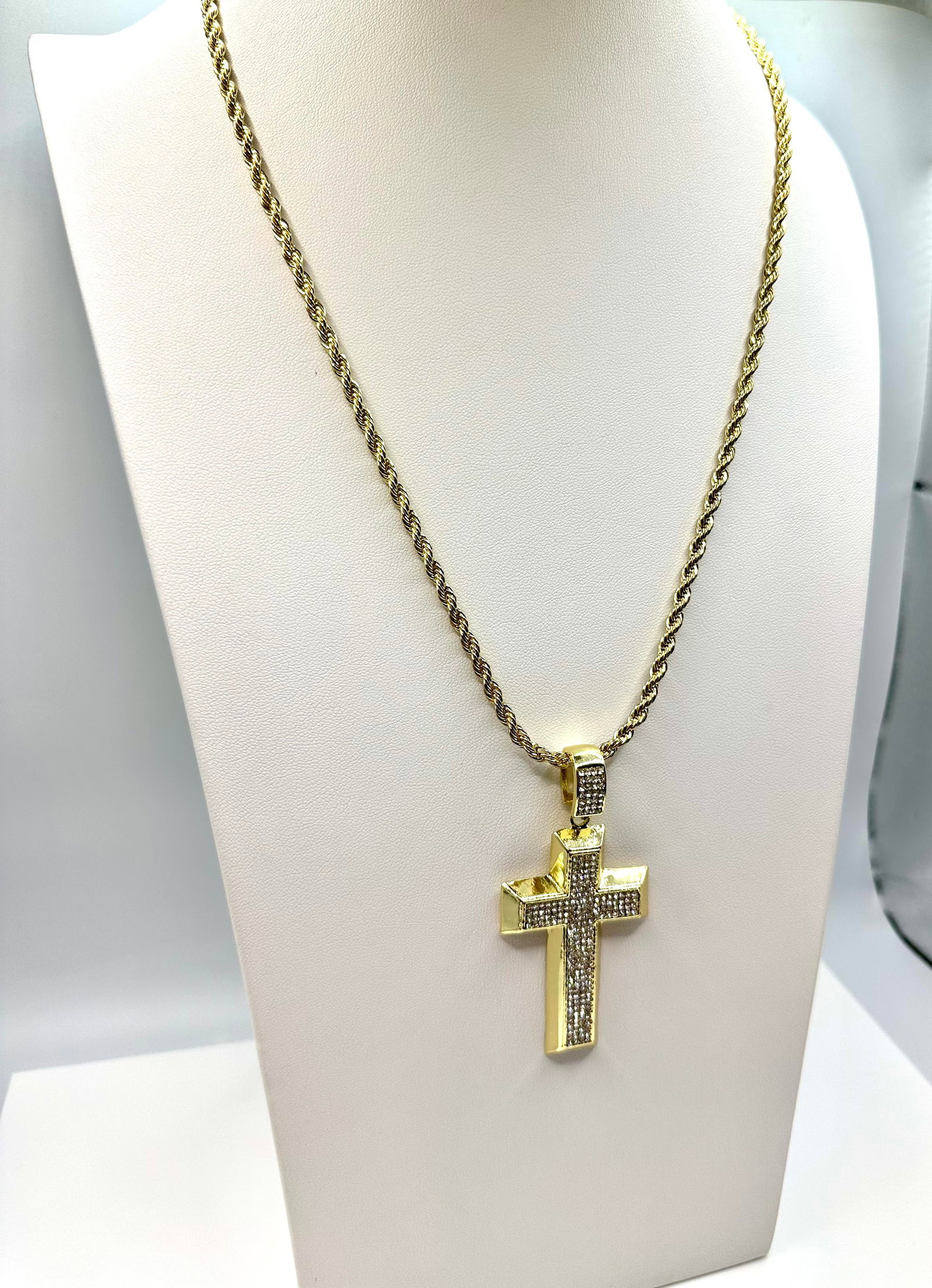 Plated 14KT Yellow Gold Simulated Diamond Cross Pendant: These Lab Simulated Diamonds Vs1 eye clean brilliant round cuts. They are eye clean and bursting out with a full spectrum of colors. They Are Mounted In 14 Kt Yellow Gold Plate which gives this cross 