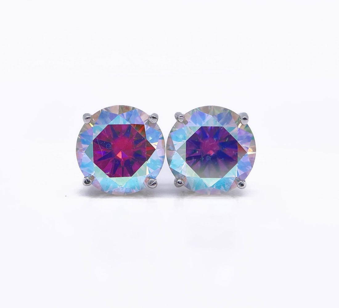 Plated 14KT White Gold 4.00ctw Ice Blue Fire Moissanite Earrings: These Beautiful Large 4 Cttw Ice Blue Fire Moissanite Earrings are eye-clean and bursting out with a full spectrum of Colors. They are Brilliant Round Cuts Measuring Approx 8 mm each and mounted in